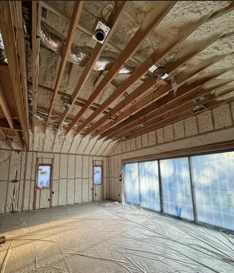 Interior walls and ceiling insulated with spray foam during new construction in Riviera Beach